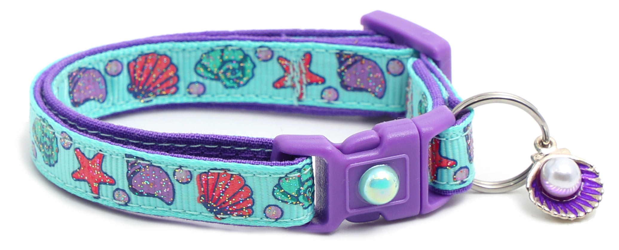 Beachcomber Breakaway Cat Collar in vibrant colors, featuring a breakaway clip and removable bell, made from soft reinforced cotton.